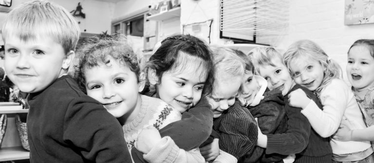 group of children hugging together