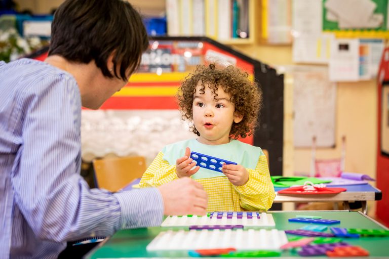 Child working on plastic toys