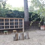 Logs and a chalkboard outside
