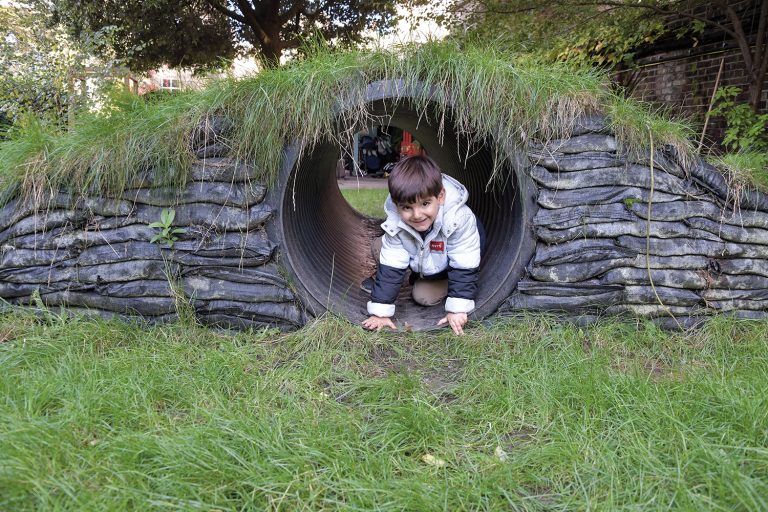 child going through a tunnel