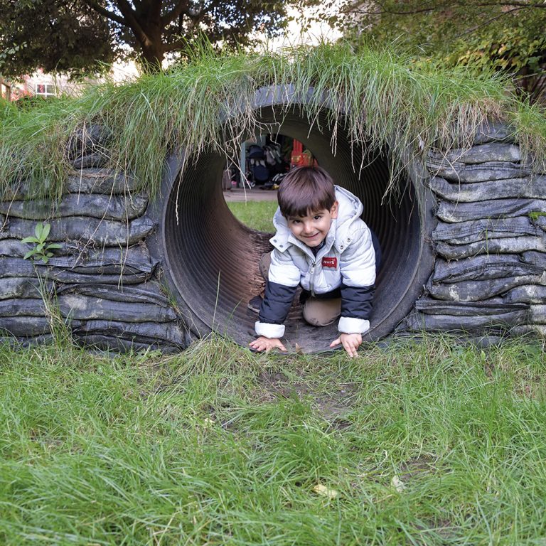child going through a tunnel