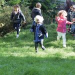 children running across the field