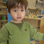 boy with khaki jumper on