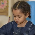 Girl wearing a denim overall