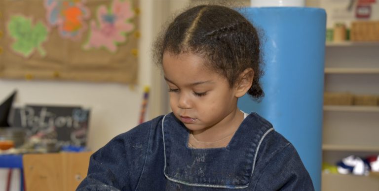 Girl wearing a denim overall