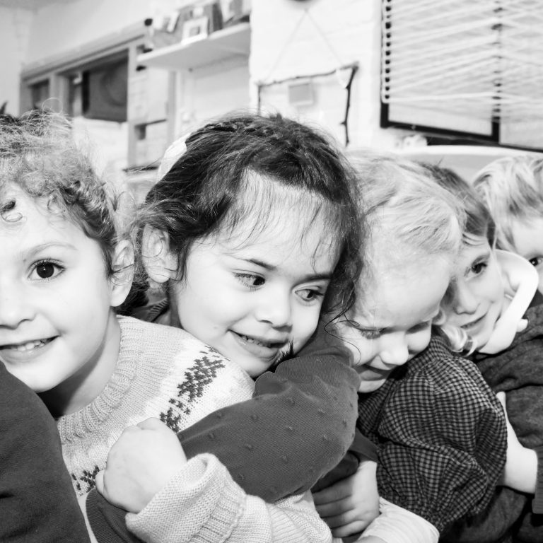 children hugging each other