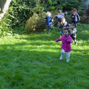 children running on grass