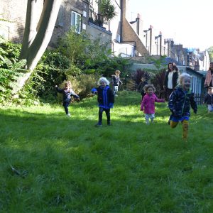 children running along the grass