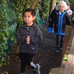 children walking down the outside of the gardens