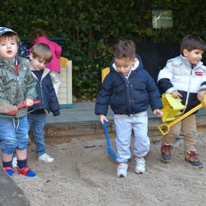 children enjoying the sand pit