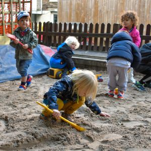 children playing in the sand pit
