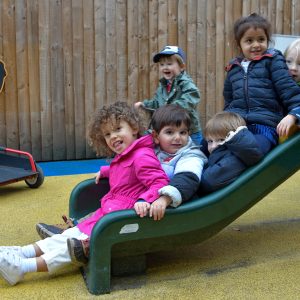 children enjoying the slide