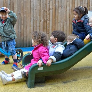 children going down a slide