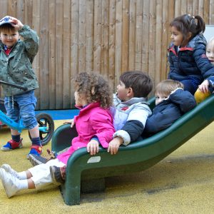 children going down a slide