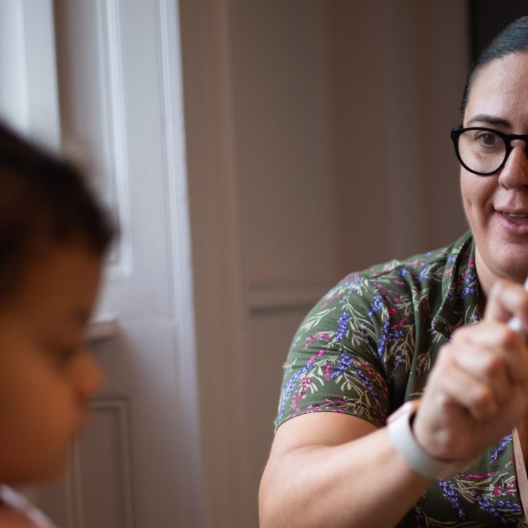 Teacher working with a student