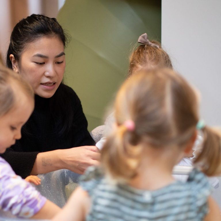 Teacher helping students