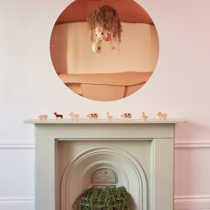 fireplace with animal cutouts on mantlepiece