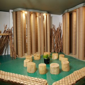 a room with wooden features and green floor