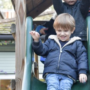 child coming down a slide