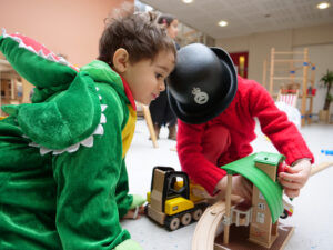 Little boy dressed up in a dinosaur costume